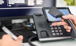 telephone and keyboard to show telecoms and switch to VoIP.