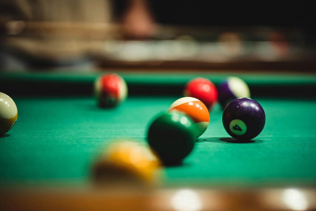 close up shot of balls on a pool table to represent social clubs