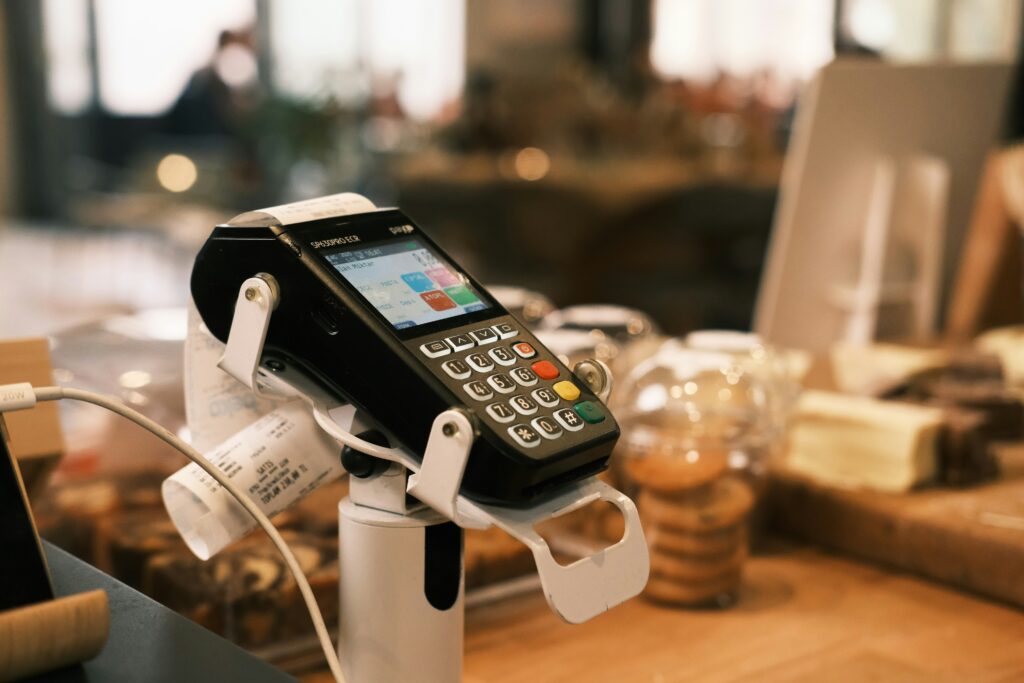 card machine on tabletop representing refunds and chargebacks